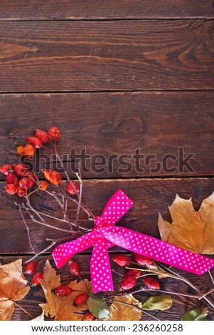 Florist table for Making autumn decorations with leafs,shears and ribbon