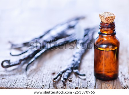 Essential oil with vanilla on a table