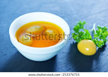 olive oil in bowl and on a table