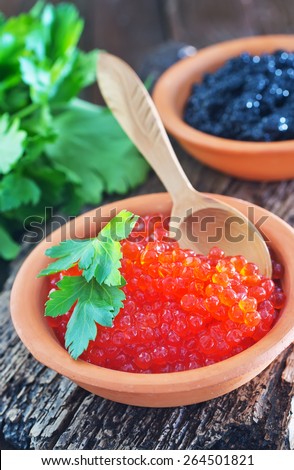 black and red caviar in bowls and on a table