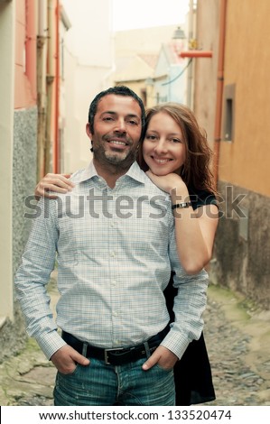 Happy italian man and young woman, retro style
