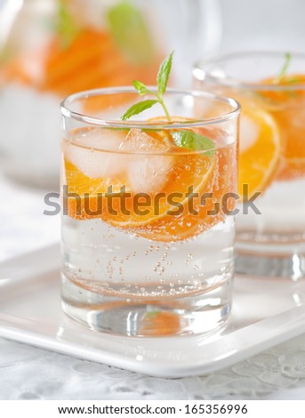 Orange mojito with rum, mint and tangerines
