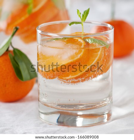 Orange mojito with rum, mint and tangerines, square image