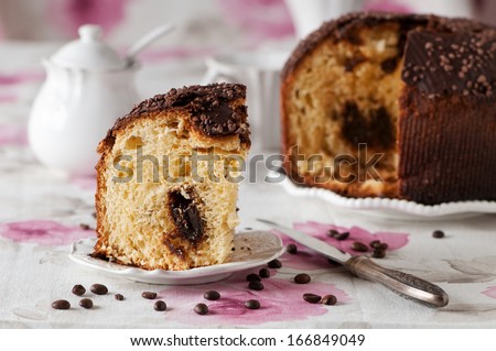 Traditional Italian panettone with coffee and chocolate, selective focus