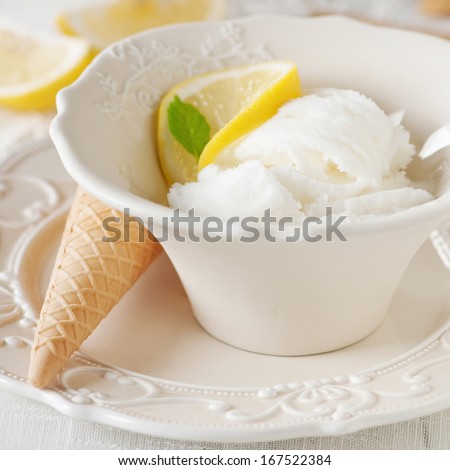 Lemon ice-cream on the table, selective focus and square image