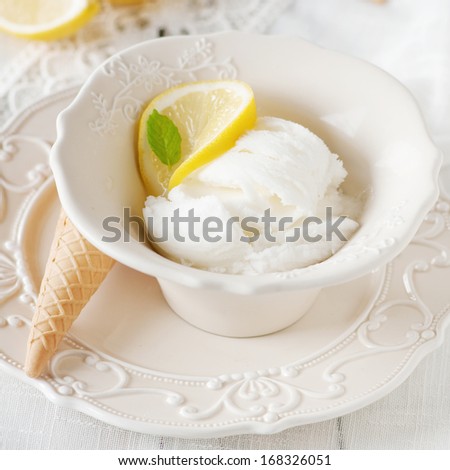 Ice-cream with lemon on the table, selective focus and square image