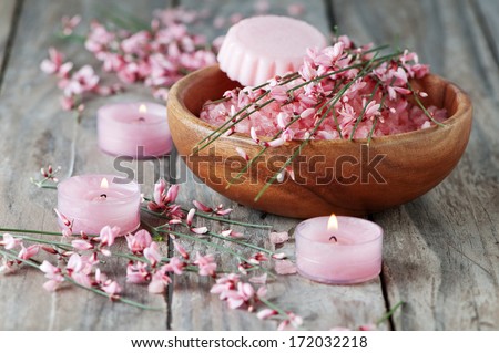 Spa with pink salt, flowers, candleas and soap, selective focus