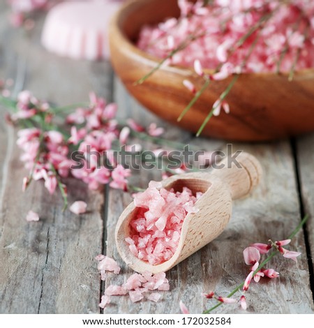 Spa with pink salt, flowers and soap, selective focus and square image
