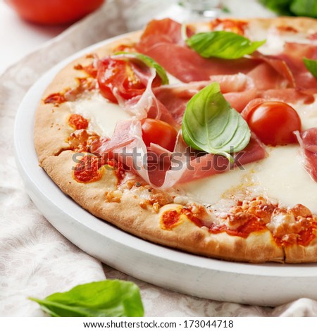 Italian Pizza With Mozzarella, Ham And Tomato, Selective Focus And Square Image