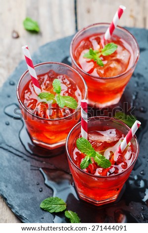 Red Cocktail with mint and ice, selective focus