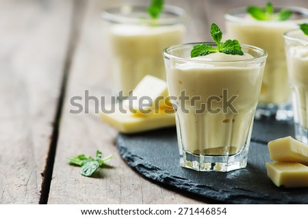 Mousse with white chocolate and mint, selective focus
