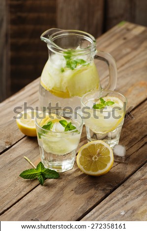 Fresh water with lemon, mint and cucumber, selective focus