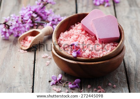 Spa concept with pink salt, soap and flowers, selective focus