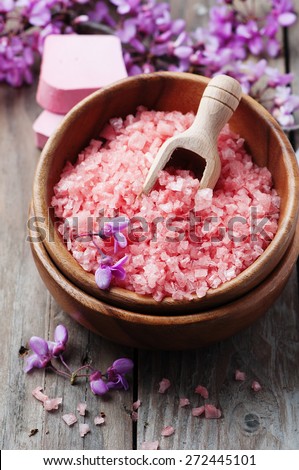 Spa concept with pink salt, soap and flowers, selective focus