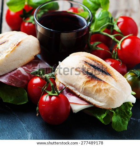 Sandwich with cheese, ham and vegetables, selective focus and square image