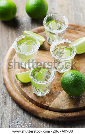Silver mexican tequila with lime, selective focus