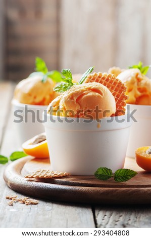 Apricot ice-cream with mint, selective focus