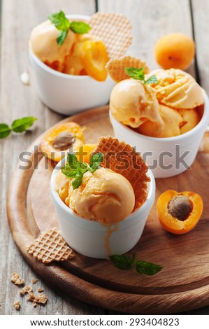 Apricot ice-cream with mint, selective focus