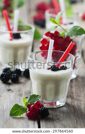 Iced milk shake with berry and mint, selective focus