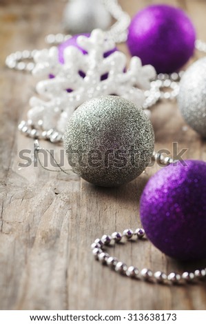 Christmas ornament with balls on the wooden table, selective focus