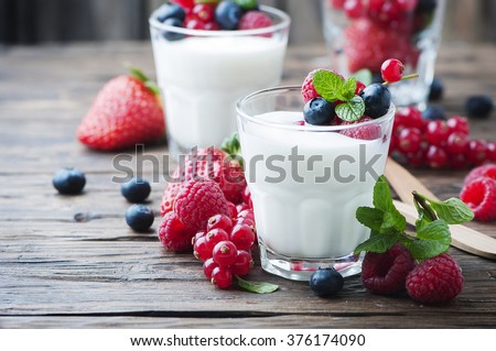 Healthy yogurt with mix of berry, selective focus