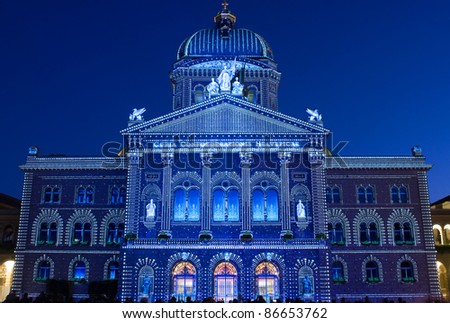 BERN - OCTOBER 14: Contours of Swiss government building (Bundeshaus) retraced with projected light spots at the sound and light show \
