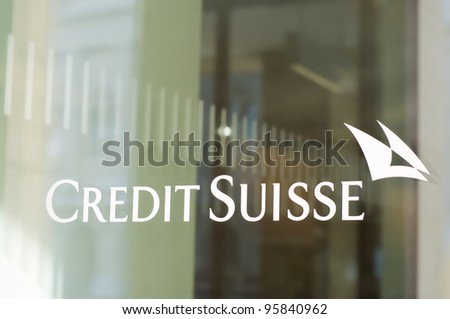 BERN - FEB 18: The Credit Suisse logo in a window of a branch. CS is a globally active financial services company, on February 18, 2012 in Bern, Switzerland.