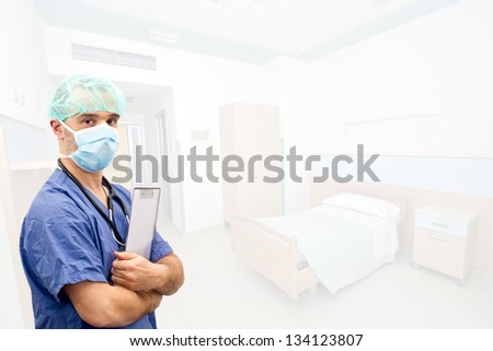 Doctor with surgical mask in hospital bedroom background