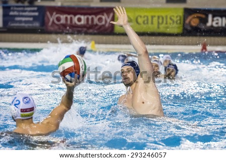 NAPOLI - MAY 12: G. Bini ( Blue cap, Bpm Sport Management) in game BPM Sp. Management vs Acquachiara Napoli  - Italian Water Polo Play Off on May 12, 2015 in Napoli, Italy.