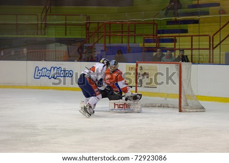 MILAN, ITALY - MARCH 9: A big mistake in goalie zone by Peter Wunderer (HC Milan Red Blue ) in game HC Milan vs. HC Gherdeina  on March 9, 2011 in Milan, Italy.