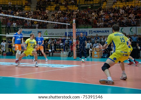 MONZA, ITALY - APRIL 13:  M. Piscopo ( n. 18 Modena )  looking the ball   in Volley Gabeca  Monza ( Blue) vs Volley Modena ( Yellow) -Italian Volley League on  2011 April, 13 in Monza  (Italy)