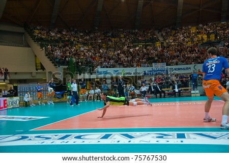 MONZA, ITALY - APRIL 20:  Exiga looking for the ball in Volley Gabeca Monza ( Blue) vs Volley Modena ( Yellow) -Italian Volley League on 2011 April, 20 in Monza (Italy)