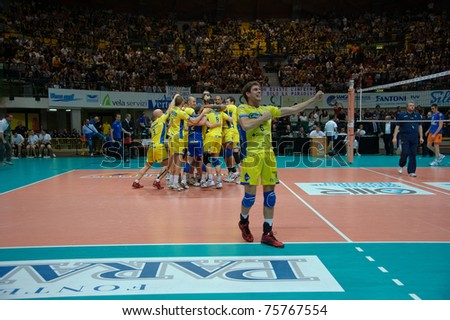 MONZA, ITALY - APRIL 20: Volley Modena winning game  in Volley Gabeca Monza ( Blue) vs Volley Modena ( Yellow) -Italian Volley League on 2011 April, 20 in Monza (Italy)