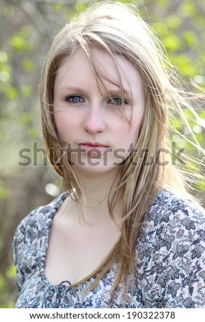 Beautiful blond model outdoors in rural setting natural light