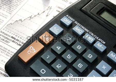 Math equipment, calculator on a business newspaper