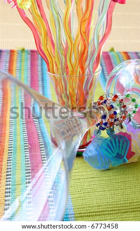 Martini Glass and Cocktail Sticks on a colorful placemat