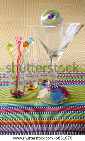 Martini Glass and Cocktail Sticks on a colorful placemat