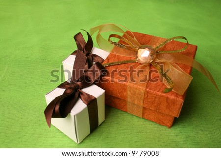 White and Copper gift boxes with ribbons and pebble