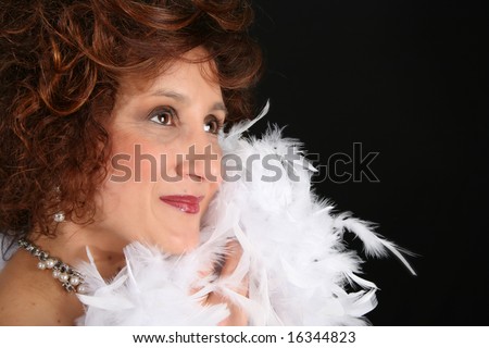 Rich and stylish female with feathers and jewelery
