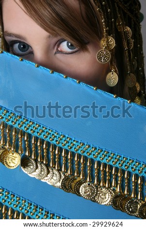 Beautiful young teenager posing in a belly dance costume