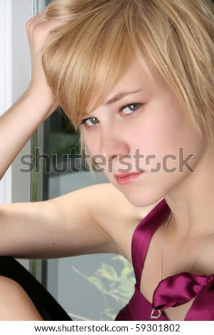 Beautiful blond female with a sad expression on her face