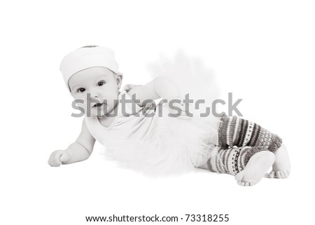 Baby girl wearing a ballet outfit and legwarmers