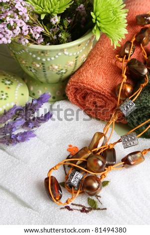 Spa Accessories setting with face cloths, gloves and flowers
