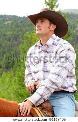 Passionate young cowboy spending time with his horse