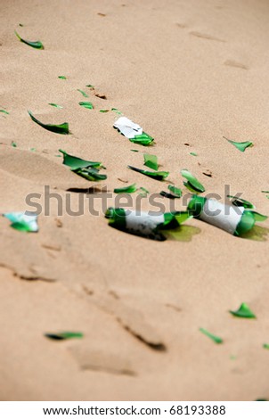 Broken beer bottle in the sand dunes