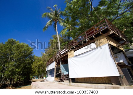 restaurant building, one building stand alone on shore in clear blue sky
