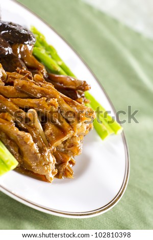 Chinese food goose, stewed goose legs with vegetable and mushroom for sides