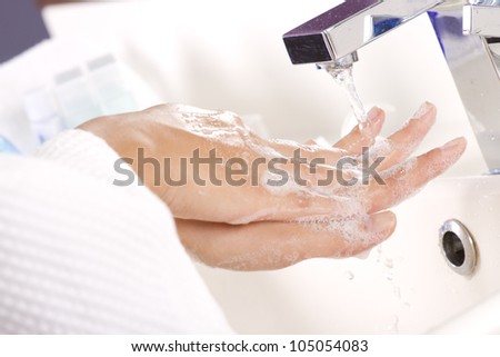 Hand wash,  female hand washing soap in tap water