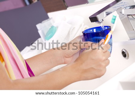 Prepare brushing, female prepare brushing teeth at tab water sink