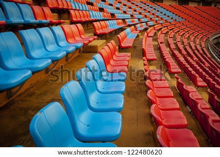 stadium seat, red and blue seat on stadium steps bleacher